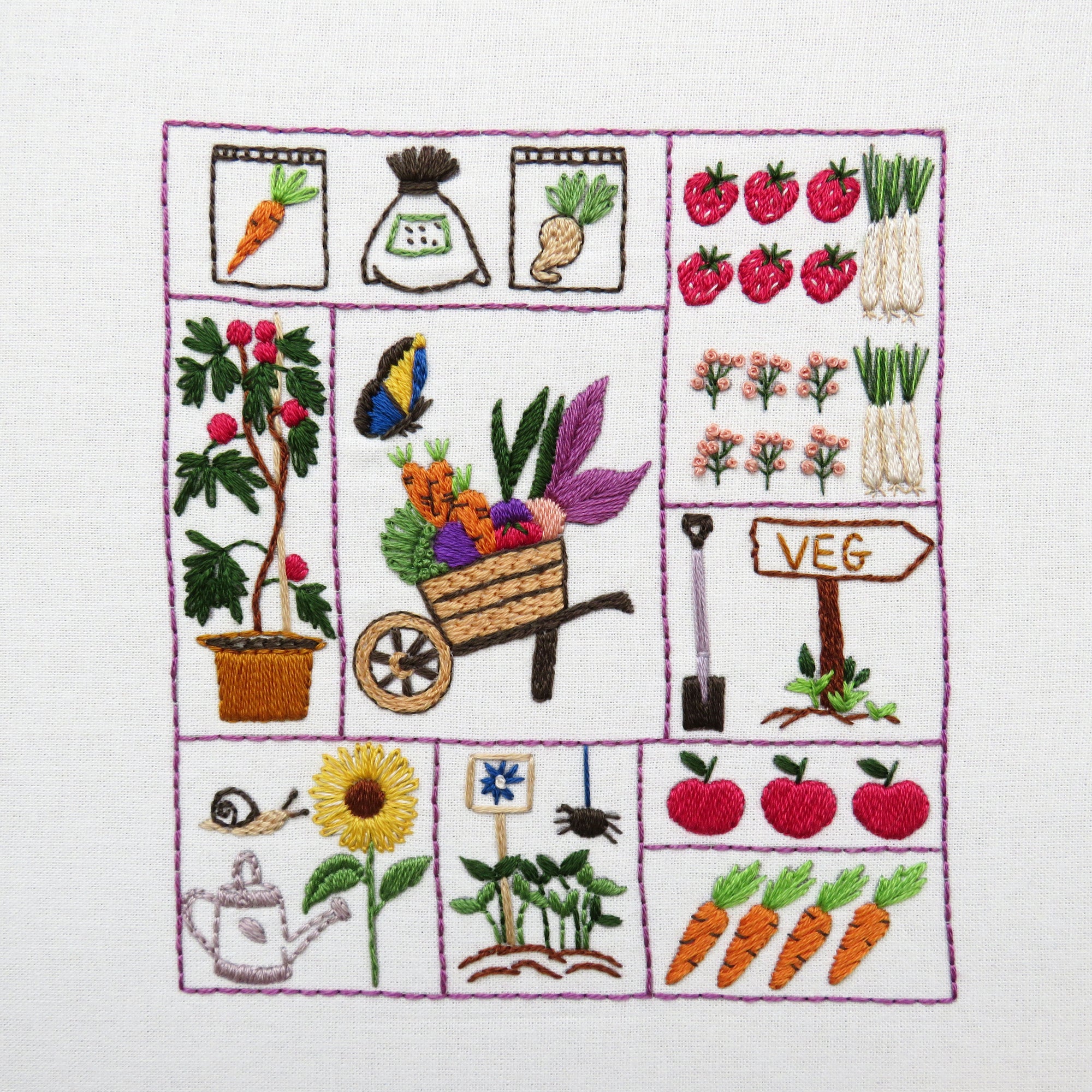 Embroidered design with gardening elements on a white background