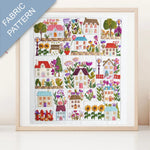 Framed fabric pattern with colorful houses and flowers on a white background