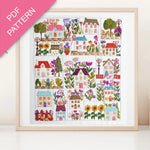 Framed cross-stitch pattern with colorful houses and flowers on a white background