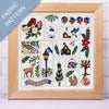 Framed fabric pattern with nature-themed designs including birds, flowers, and animals.