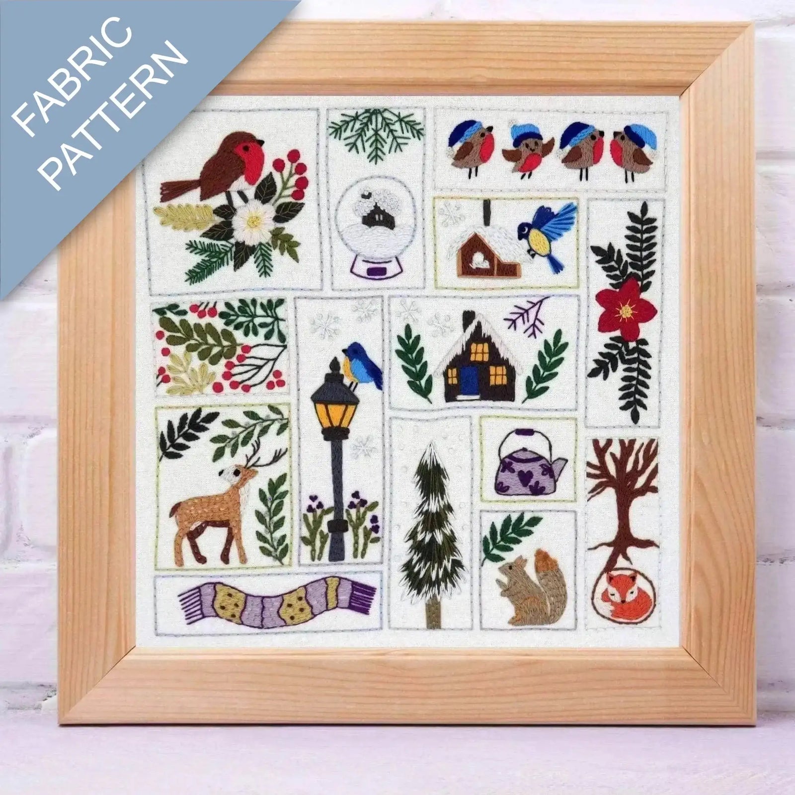 Framed fabric pattern with nature-themed designs including birds, flowers, and animals.