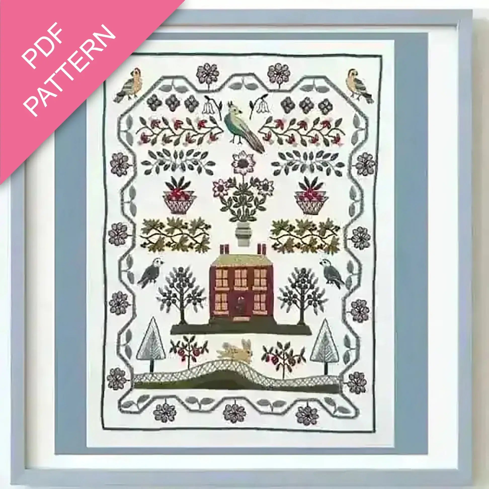 Embroidery pattern with house, trees, and birds on a white background with a pink and blue border.