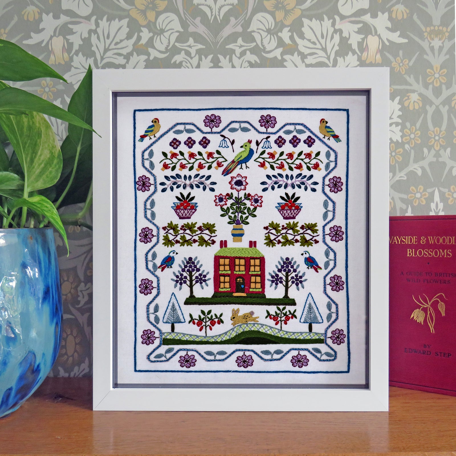 winterberry cottage sampler and embroidery kit and pattern framed